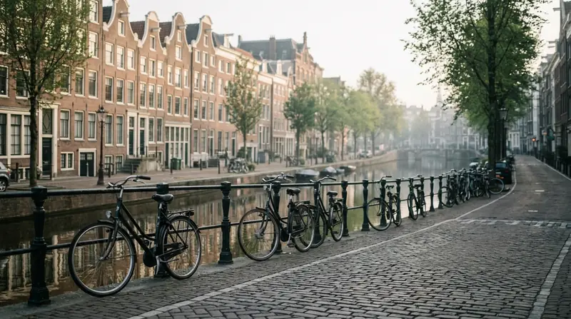 A quiet canal-side street in Amsterdam in early morning light